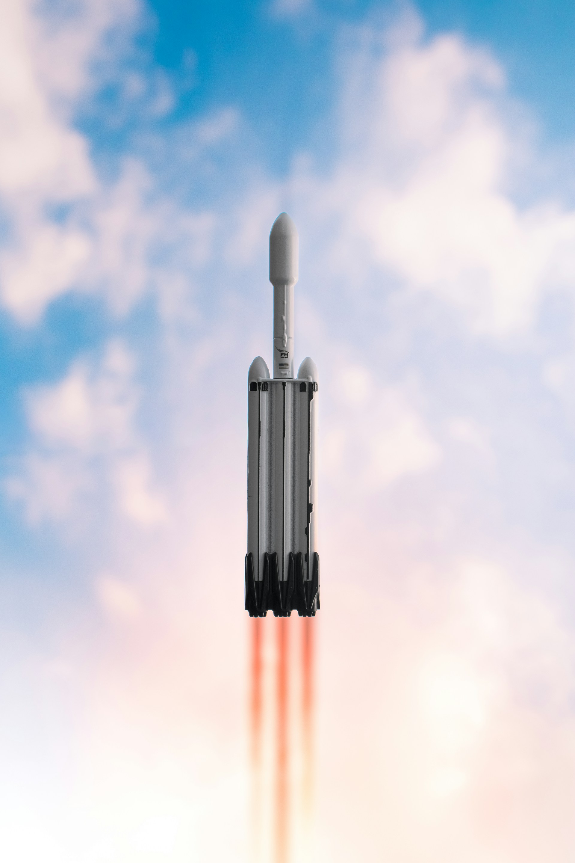 Rocket launching into cloudy sky