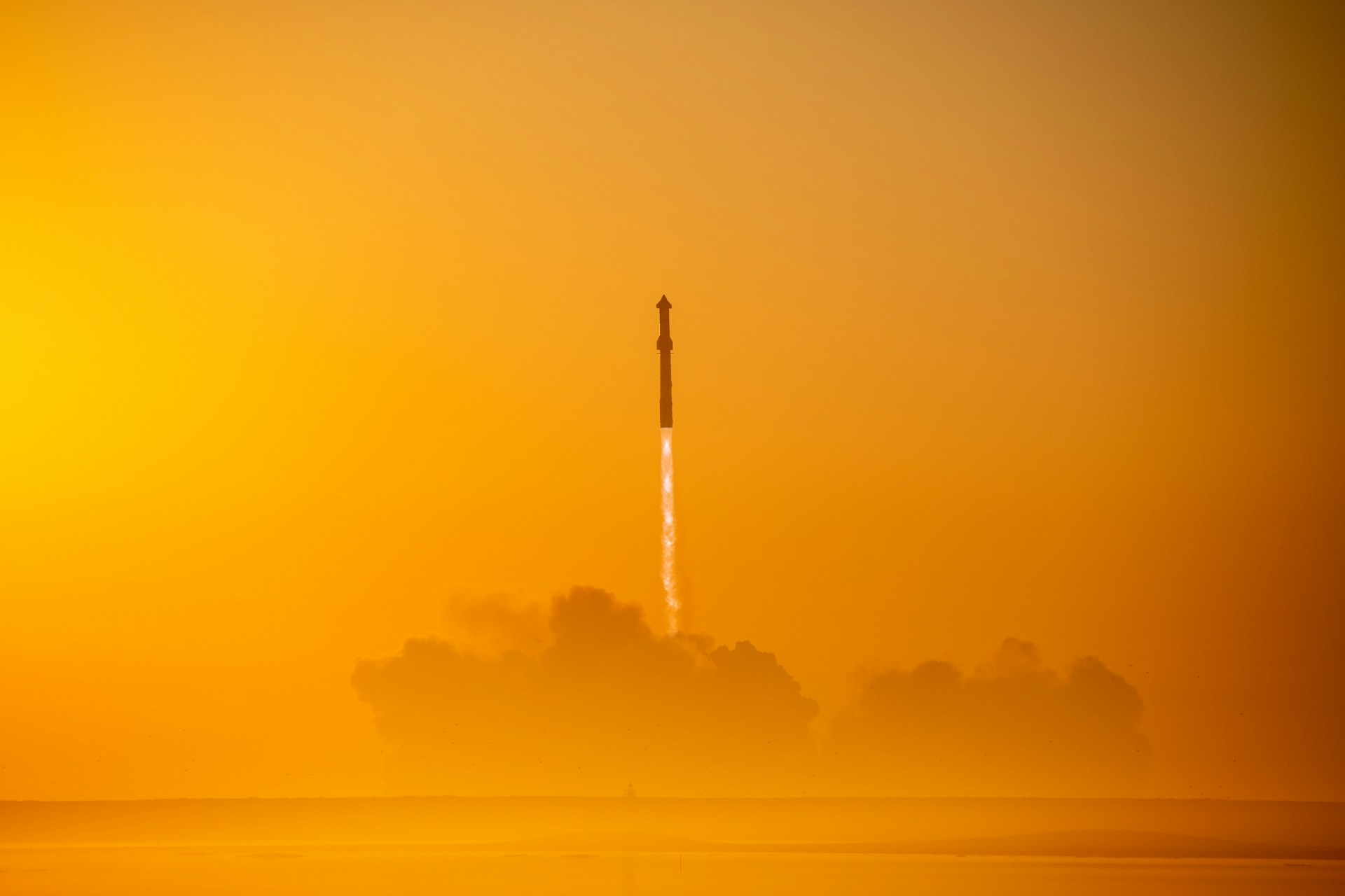Rocket ascending through fog