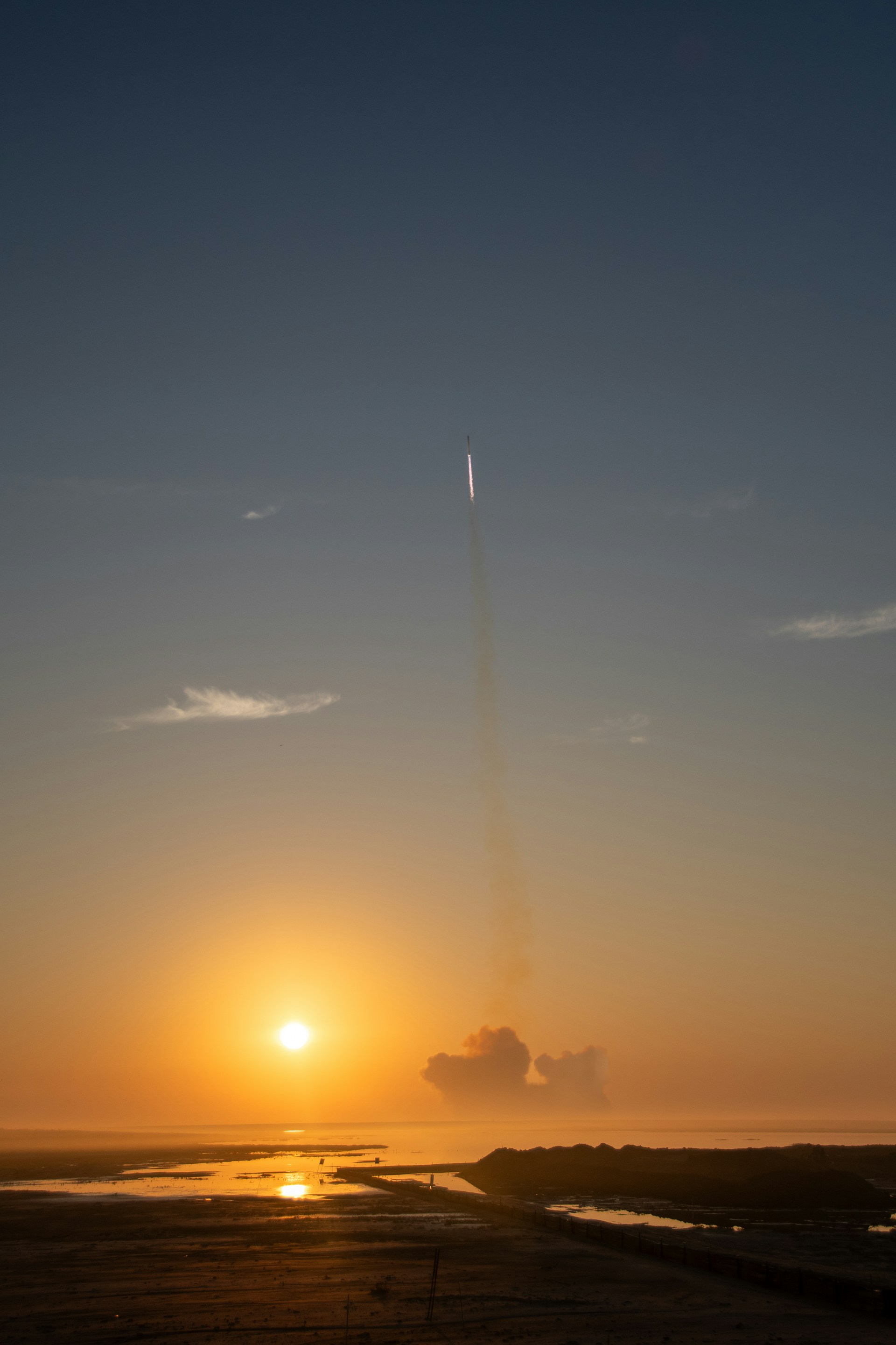 Rocket launch at sunset from Starbase